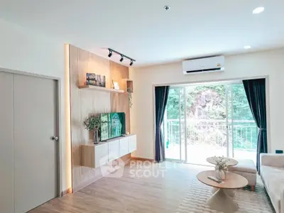 Bright modern living room with balcony and stylish decor