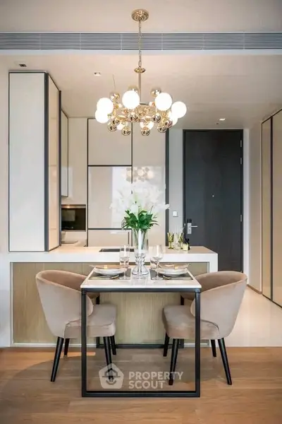 Modern dining area with elegant chandelier and stylish decor