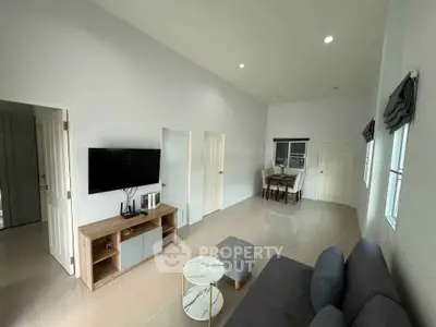 Spacious modern living room with sleek furniture and natural light