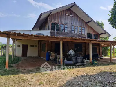 Charming rustic wooden house with spacious outdoor area and covered patio.