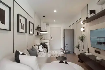 Modern living room with stylish decor and open kitchen layout in a contemporary apartment.