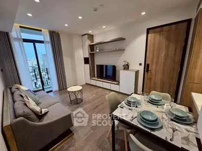 Modern living room with stylish decor and city view from large window.