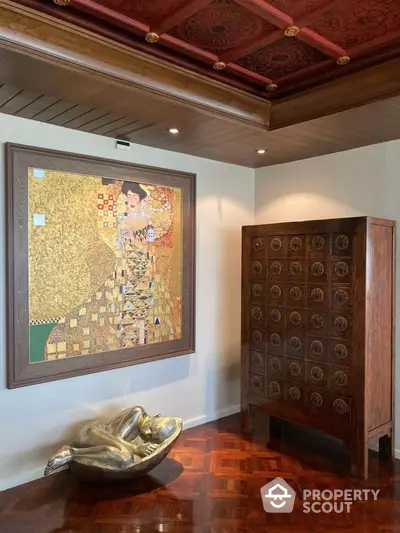 Luxurious interior with elegant artwork and unique wooden cabinet