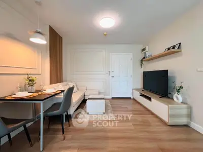 Modern living room with stylish decor and cozy seating area, perfect for relaxation and entertainment.