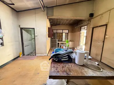 Charming rustic kitchen with wooden accents and ample natural light, perfect for cozy home cooking.