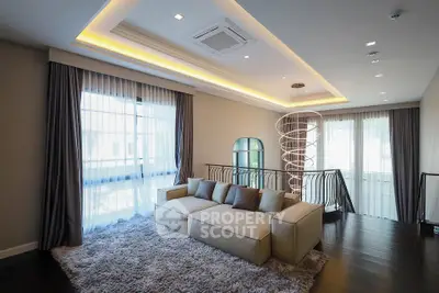 Luxurious living room with modern lighting and plush sofa in elegant home