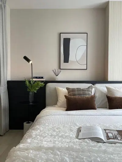Modern bedroom with stylish decor and cozy bedding