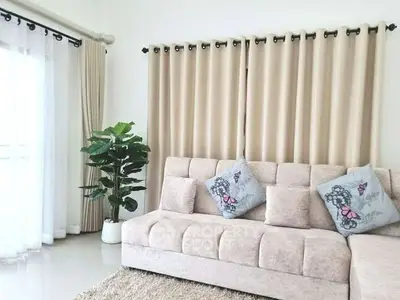 Elegant living room with plush sofa and stylish curtains