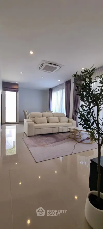 Spacious modern living room with elegant decor and natural light