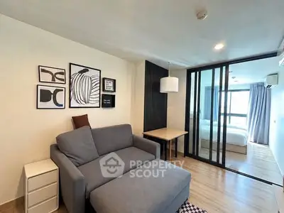 Modern living room with stylish decor and cozy seating in a contemporary apartment.
