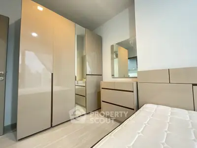 Modern bedroom with sleek wardrobe and minimalist design