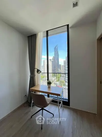 Modern study room with city view, featuring sleek desk and chair, perfect for productivity.