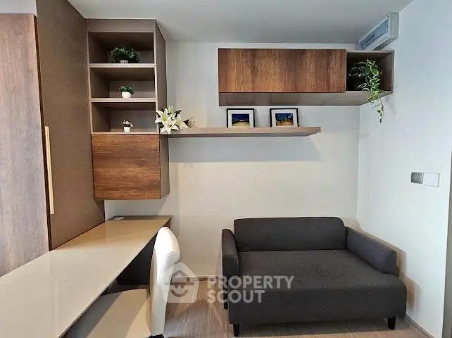 Modern living room with sleek furniture and built-in shelving, perfect for urban living.