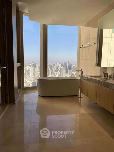 Luxurious bathroom with city skyline view and freestanding bathtub