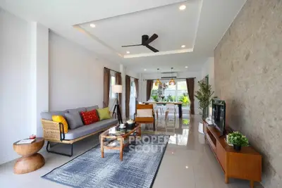 Spacious modern living room with stylish decor and natural light