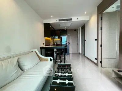 Modern living room with sleek design and open kitchen layout