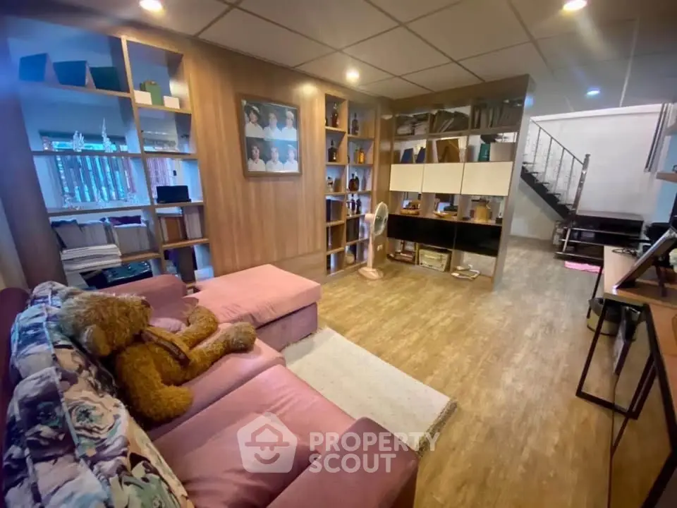 Spacious living room with cozy seating and modern decor, perfect for relaxation and entertainment.