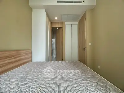 Modern bedroom with wooden accents and en-suite bathroom