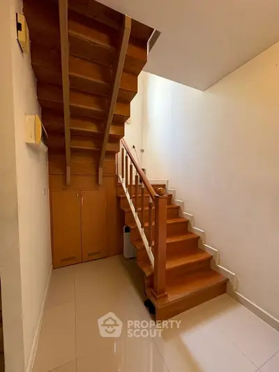 Charming wooden staircase with storage in modern home interior