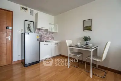 Modern compact kitchen with dining area in stylish apartment