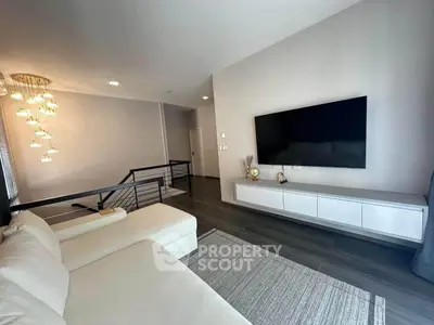 Modern living room with sleek TV setup and elegant lighting