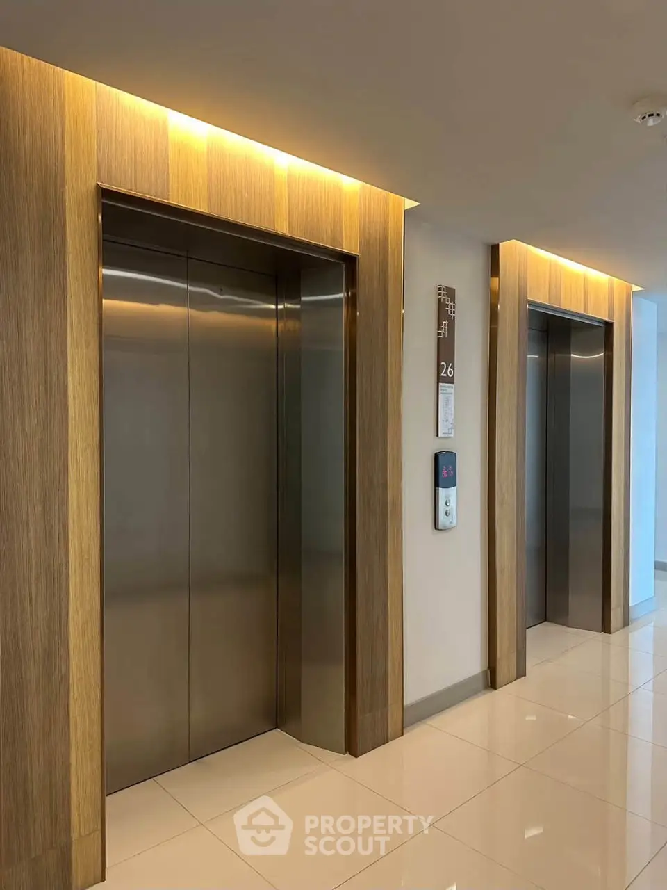 Modern building elevator lobby with sleek design and ambient lighting