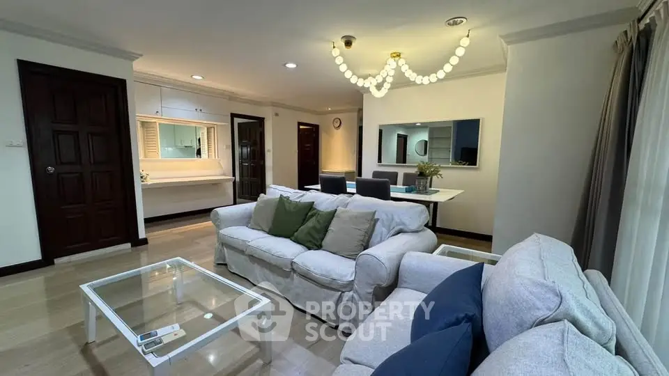 Spacious living room with elegant decor and modern furniture in a cozy apartment.