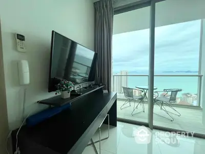 Modern living room with ocean view balcony in high-rise apartment