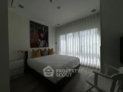 Modern bedroom with large window and stylish decor