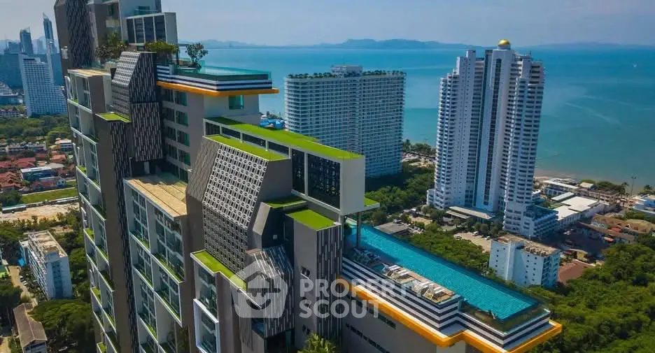 Stunning high-rise building with rooftop pool and ocean view in prime urban location.