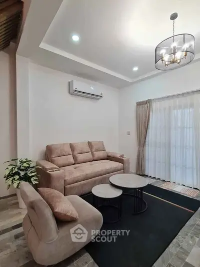 Modern living room with stylish furniture and elegant lighting