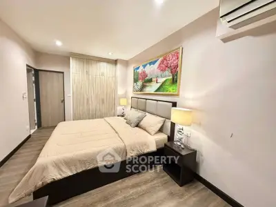 Cozy bedroom with modern decor and serene wall art