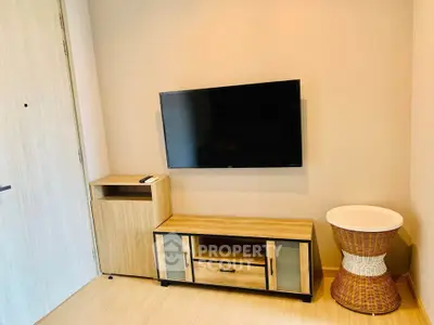 Modern living room with mounted TV and stylish wooden furniture
