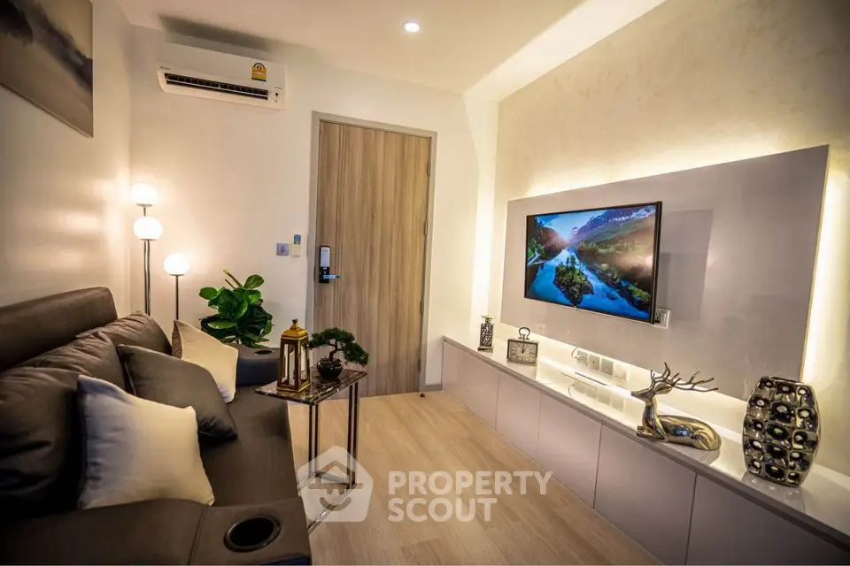 Modern living room with stylish decor and wall-mounted TV
