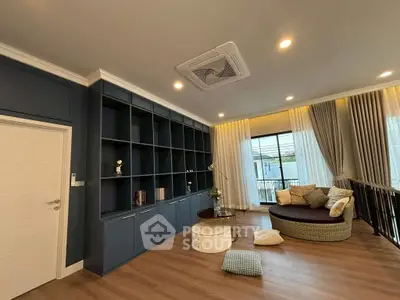 Spacious living room with modern design and large windows