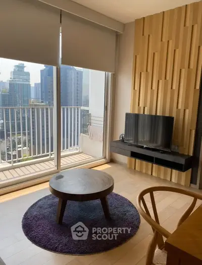 Modern living room with balcony view in urban high-rise apartment