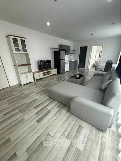 Spacious modern living room with open kitchen and stylish decor