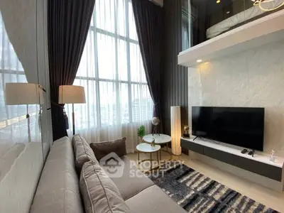 Luxurious modern living room with high ceilings and mezzanine, featuring elegant decor and large windows.