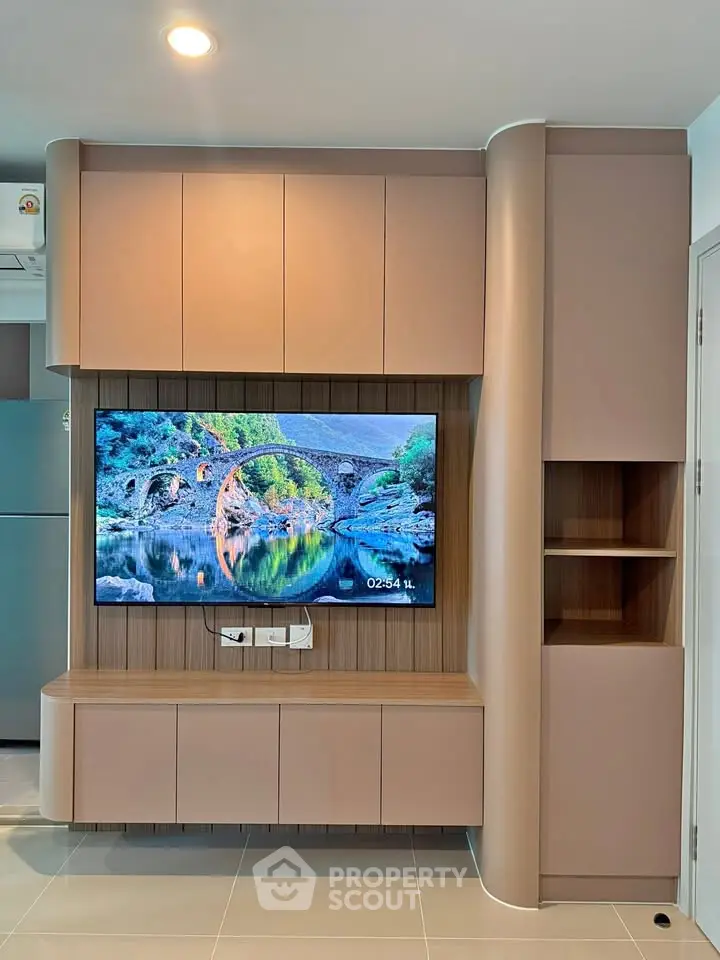 Modern living room with sleek built-in TV unit and stylish cabinetry