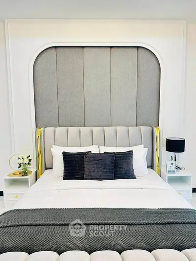 Luxurious modern bedroom with elegant decor and plush bedding