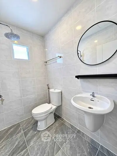 Modern bathroom with sleek fixtures and elegant tile design