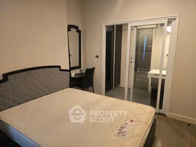 Cozy bedroom with ensuite bathroom and modern furnishings