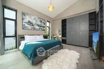 Luxurious modern bedroom with elegant decor and ample natural light