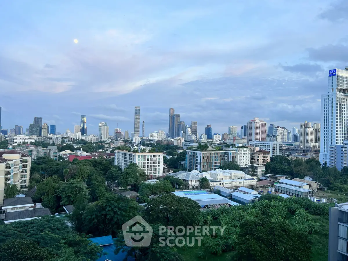 Stunning cityscape view showcasing a vibrant skyline and lush greenery, perfect for urban living enthusiasts.