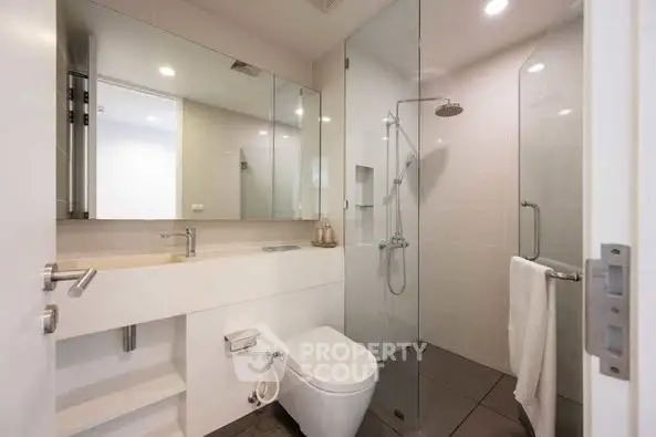 Modern bathroom with sleek design and glass shower enclosure