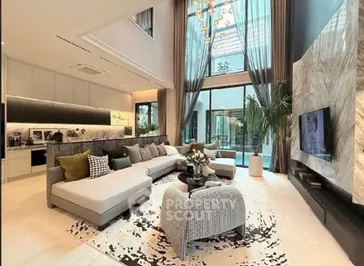 Luxurious modern living room with high ceilings and elegant decor