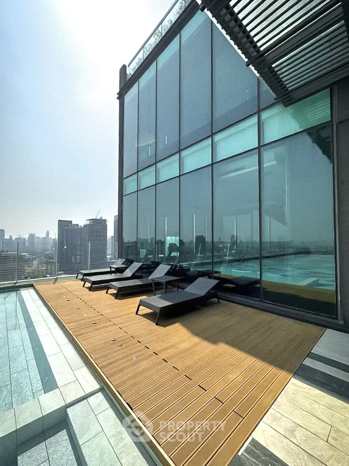Luxurious rooftop pool area with stunning city views and modern lounge chairs.