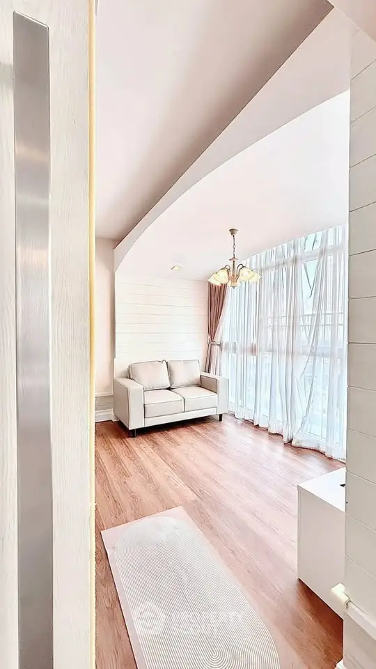 Bright and airy living room with large windows and elegant decor