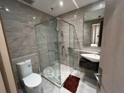 Modern bathroom with glass shower and sleek fixtures