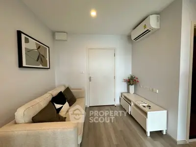 Modern living room with sleek design and air conditioning, perfect for comfort and style.